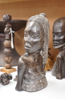 Two African tribal busts, two carved spoons and three carved Kamba Kenyan stools (11). Largest stool 28cm high. Condition - mostly good, some staining to seat of largest stool